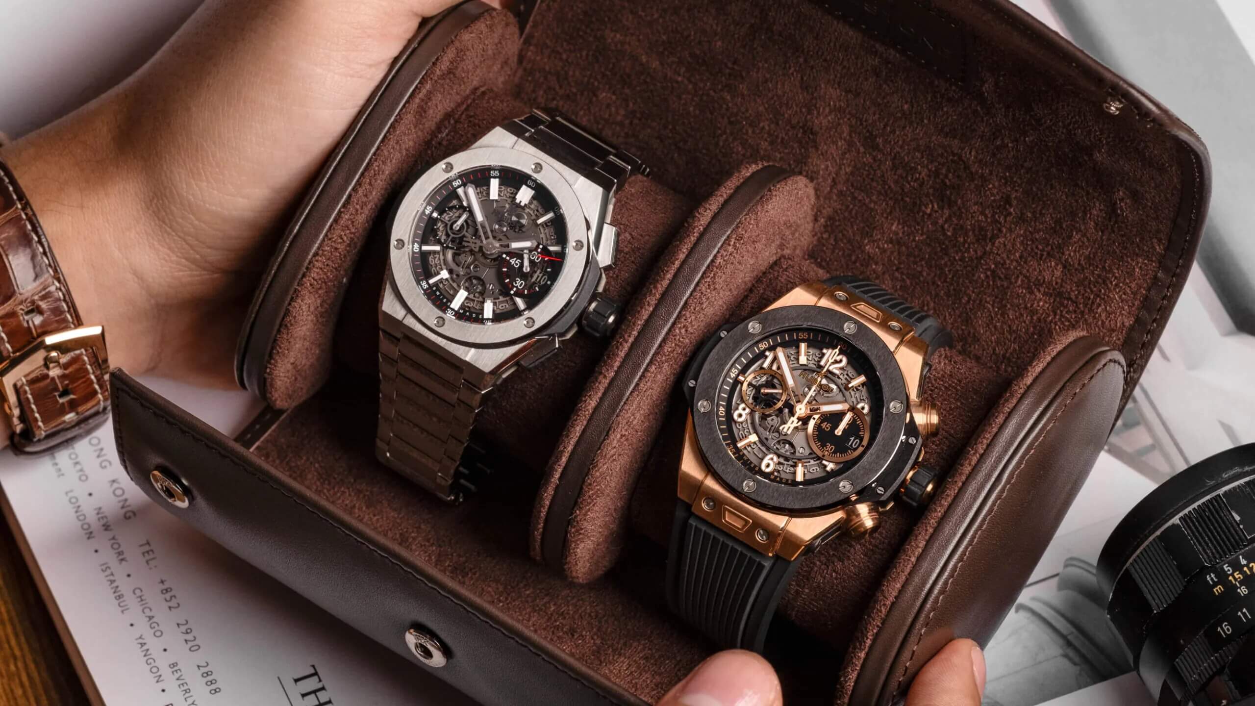 2 watches in a brown casing